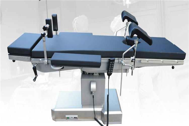 手动液压传动手术床采用气缸作为执行元件来控制台面的各个动作，体位动作大多由手操控气动弹簧助力系统来实现